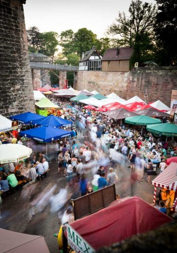 Nuremberg, Germany, June 2015.Beer Festival next the city Castle.Nuremberg, a city in Bavaria, is distinguished by its medieval architecture, including the fortifications and stone towers of its Altstadt (Old Town).