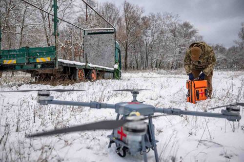 Ukraine, on the outskirts of Kiev, Nov 2022. A group of volunteers experienced in the handling of drones carries out training in order to use a drone as a transport for medicine and medical aid in combat zones on the frontline.