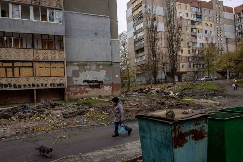 Ukraine, Mykolaiv, Nov 2022. Destruction on the streets of Mykolaiv a two-hour drive from the red line dividing Russian and Ukrainian troops where there is still brisk fighting. Residents have been without water and electricity for days and live amid bombed-out buildings.
