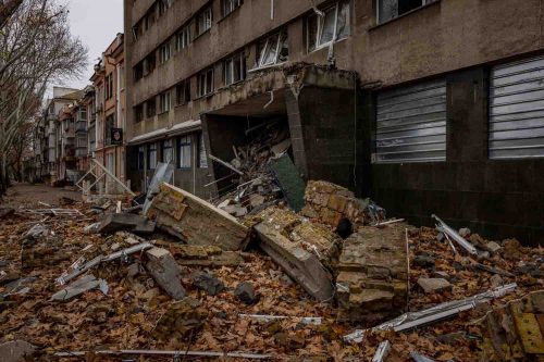 Ukraine, Mykolaiv, Nov 2022. Destruction on the streets of Mykolaiv a two-hour drive from the red line dividing Russian and Ukrainian troops where there is still brisk fighting. Residents have been without water and electricity for days and live amid bombed-out buildings.