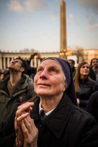 Vatican City, Rome, Italy; 28 feb 2013, People in S.Peter´s squeare sayng goodbye to Pope Benedict XVI. He left the Vatican by helicopter on Thursday afternoon to spend the final hours of his nearly eight-year, scandal-dogged papacy at the papal summer residence. Onlookers in St. Peter’s Square cheered, church bells rang and Romans stood on rooftops to wave flags as he flew from Rome to Castel Gandolfo, a hilltop town southeast of the city where popes have summered for centuries.