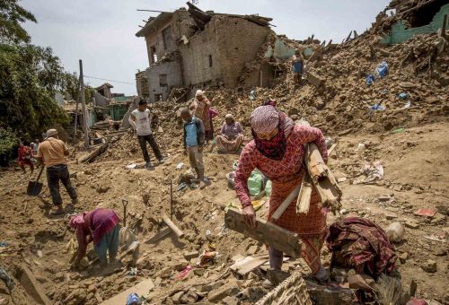Nepal, 18 may 2015.People are cleaning up the rest of destroied houses in Dharmasthali.