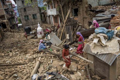 Nepal, 18 may 2015.People are cleaning up the rest of destroied houses in Dharmasthali.