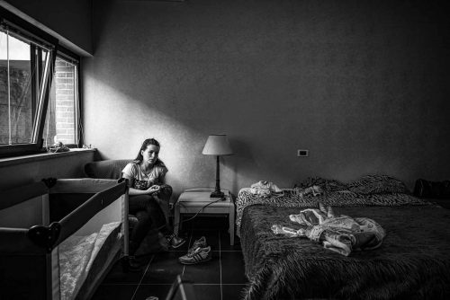 Rome, Italy, may 2013. Jenny (24) after been evicted from her house she, her husban and son occupied an empty hostal in Rome.