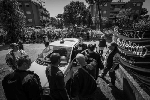 Rome, Italy, apr,2014.A security guard is trayng to convince the homeless to leave the building.