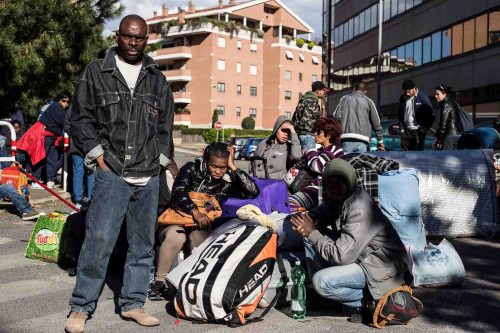 Rome, Italy, 16/4/2014.350 families are locked on the roof of an occupied building.Riot police get ready to drag away some 350 squatter families from abandoned offices in Rome