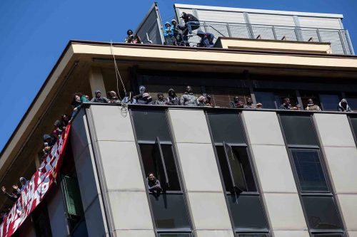 Rome, Italy, 16/4/2014.350 families are locked on the roof of an occupied building.Riot police get ready to drag away some 350 squatter families from abandoned offices in Rome