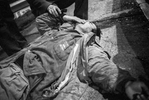 Santiago de Chile, 2003-2006:. Drunk in the street is helped by policeman
Lorenzo Moscia/GraziaNeri