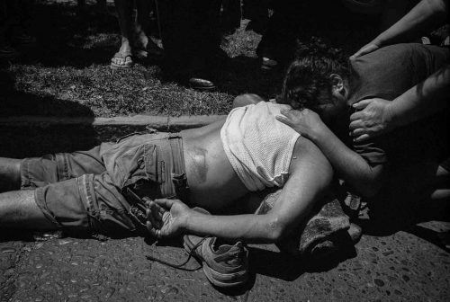 Santiago de Chile, 2003-2006: Men hit by a car, his doughter is holding him