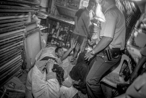 Santiago de Chile,  2003-2006: Two drugs dealers are been beaten by policemen afther a persecution